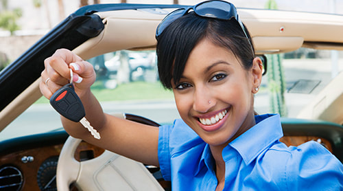 young lady holding car key